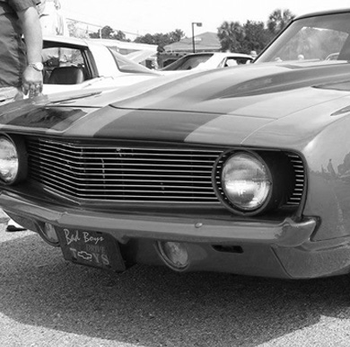 front grill of classic car with bad boys plate